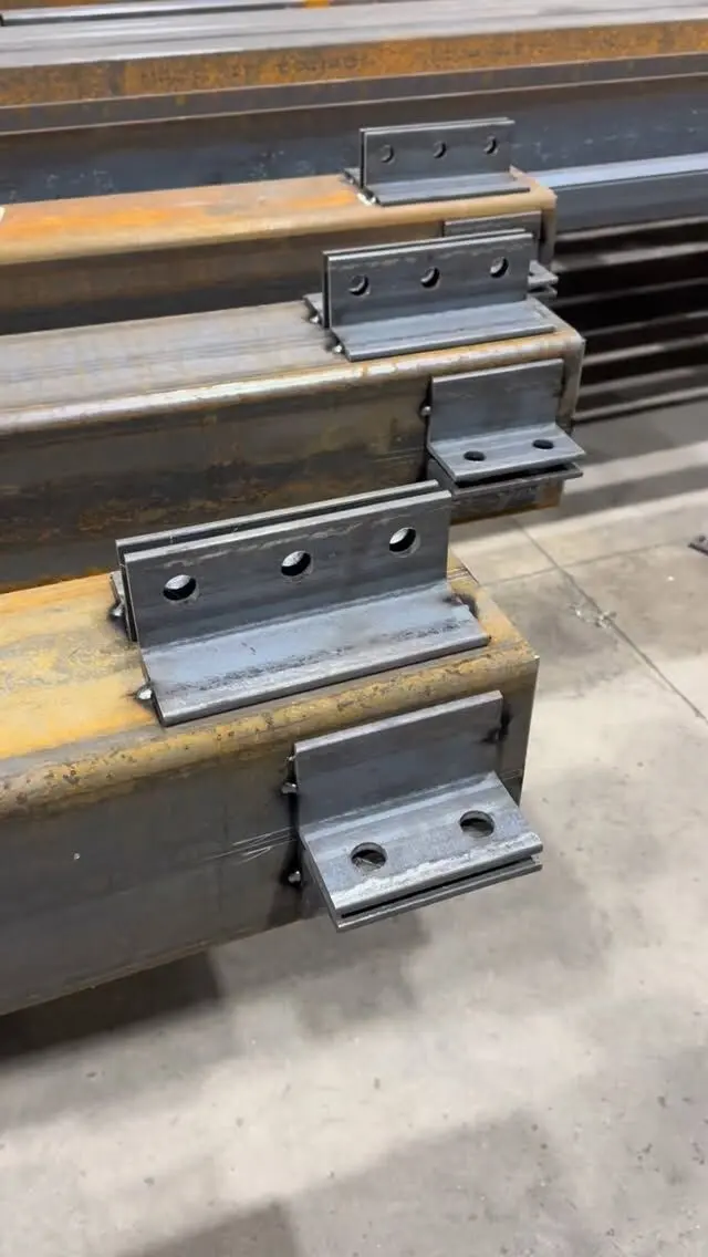 Steel beams with welded connection plates
